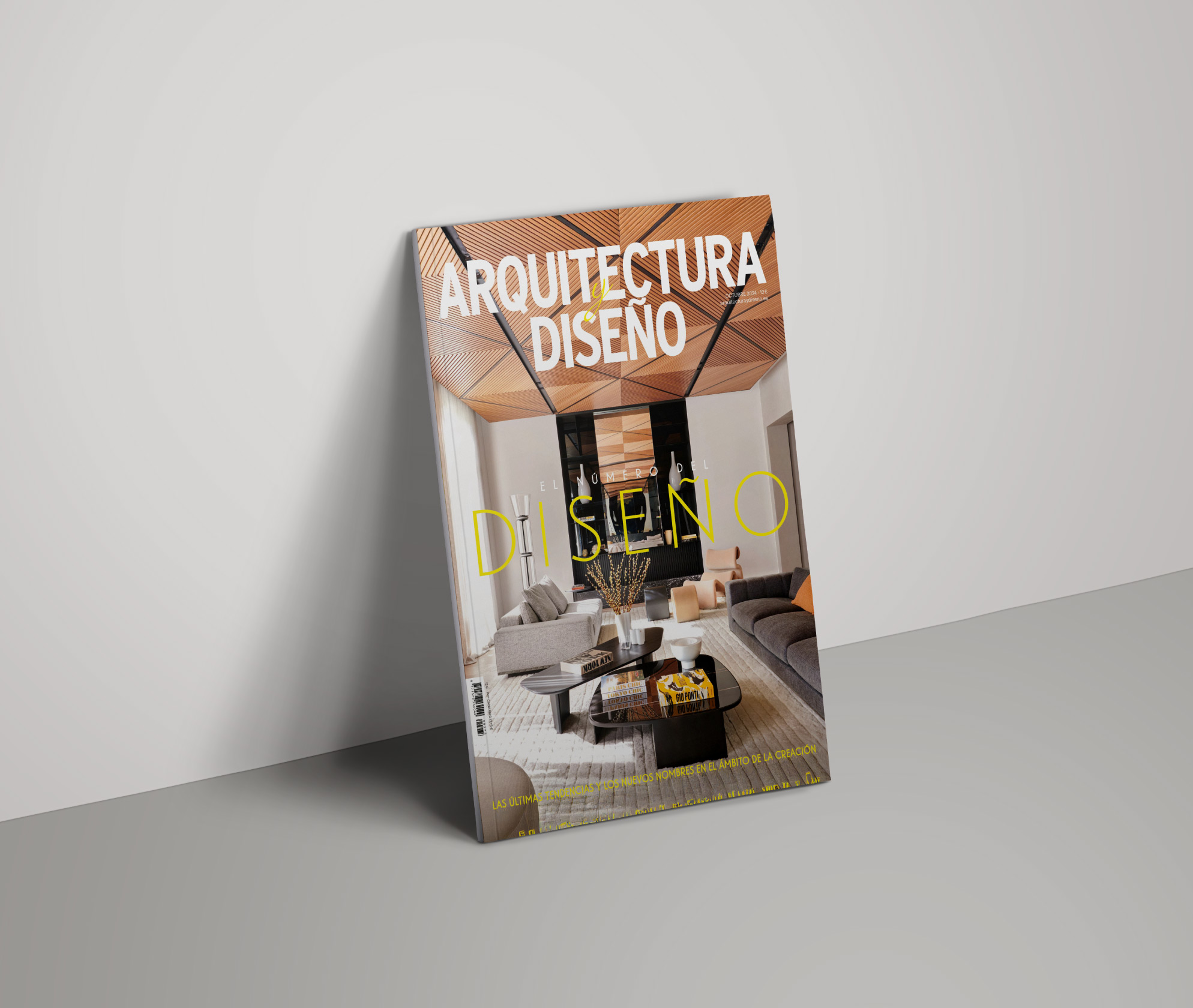 Architectural Digest Spain magazine featuring a living room designed by LUV Studio, with a geometric wooden ceiling and contemporary furniture.